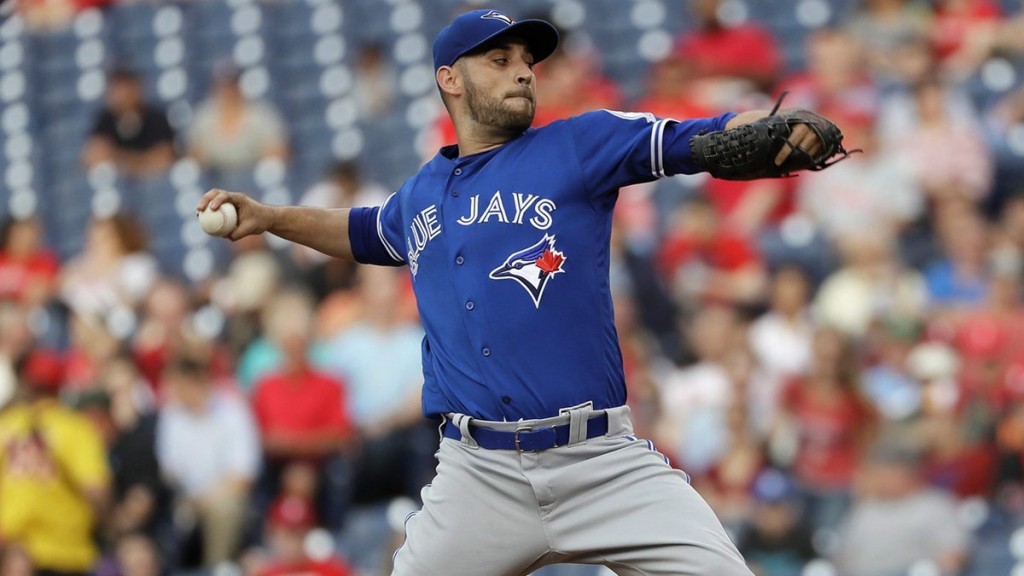 Toronto Blue Jays' Devon Travis hits an RBI single during the