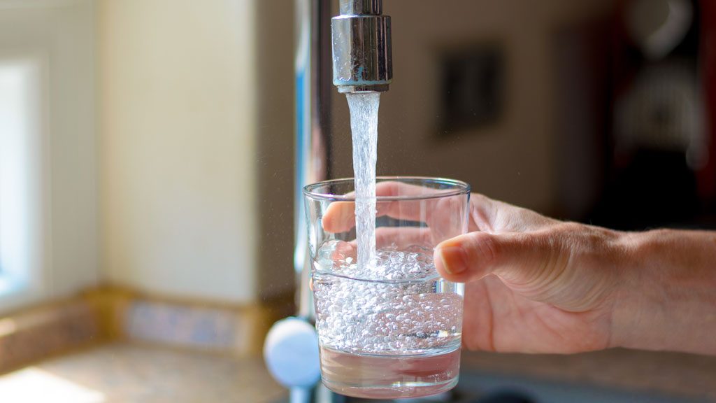 A file photo shows water coming from a tap.