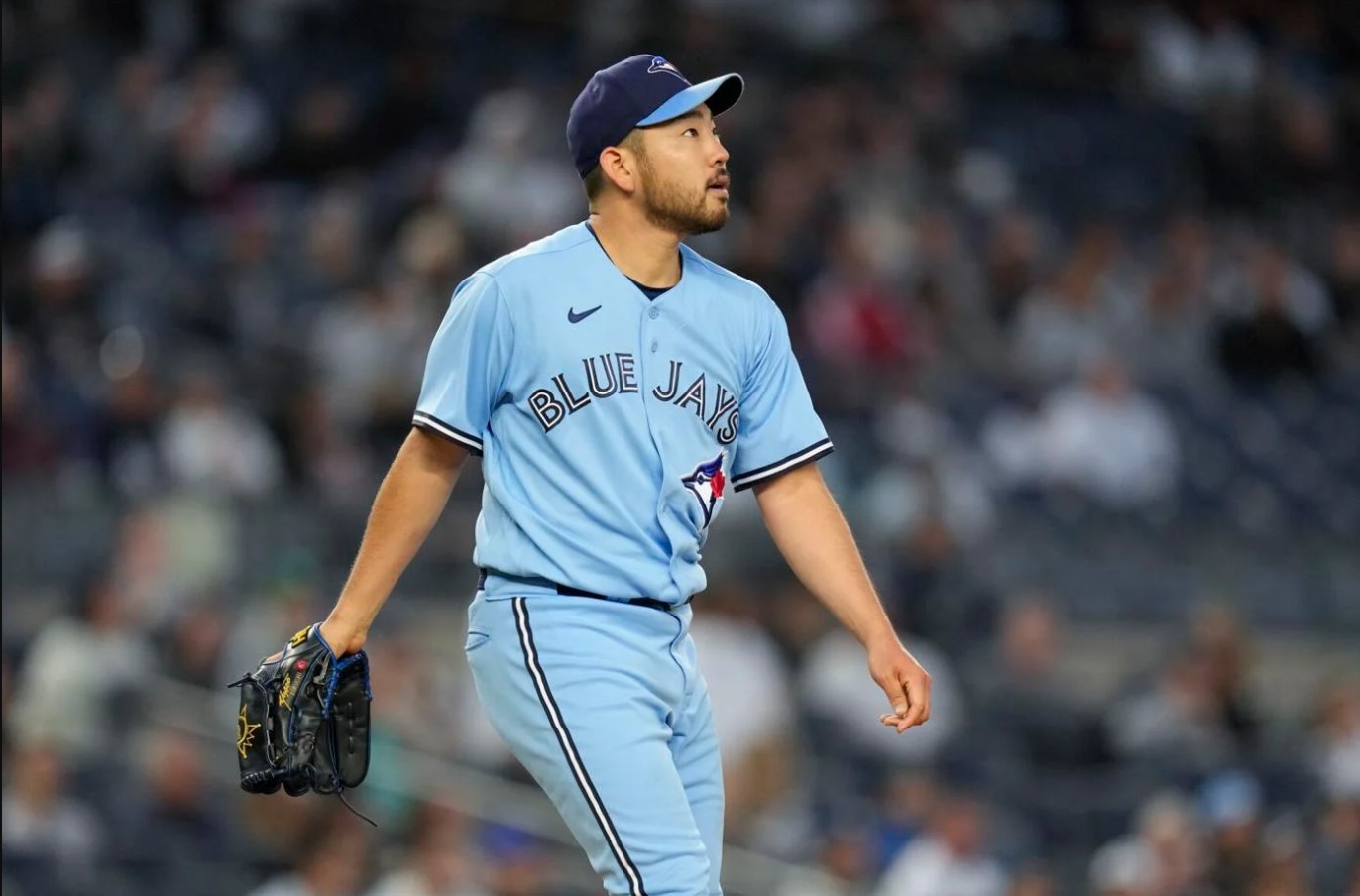 Yusei Kikuchi of the Toronto Blue Jays smiles at the end of the