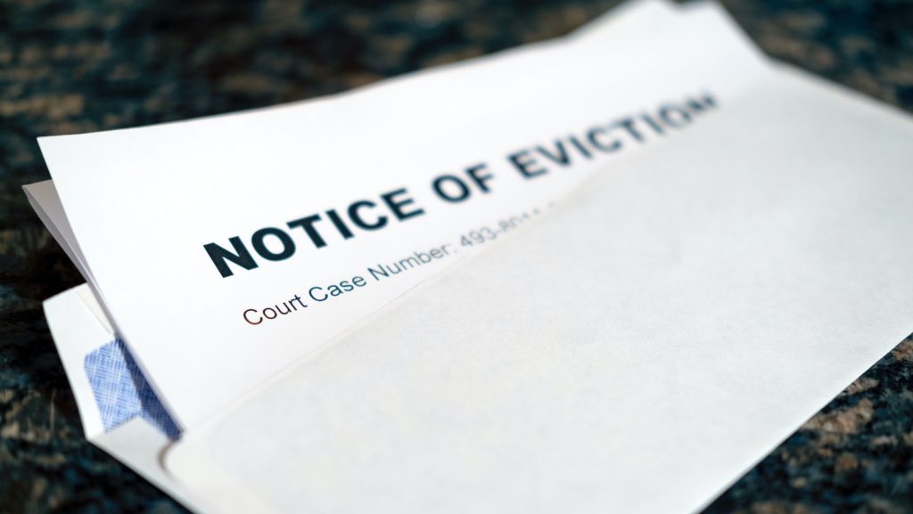 a close up of a piece of paper with a notice of eviction on it