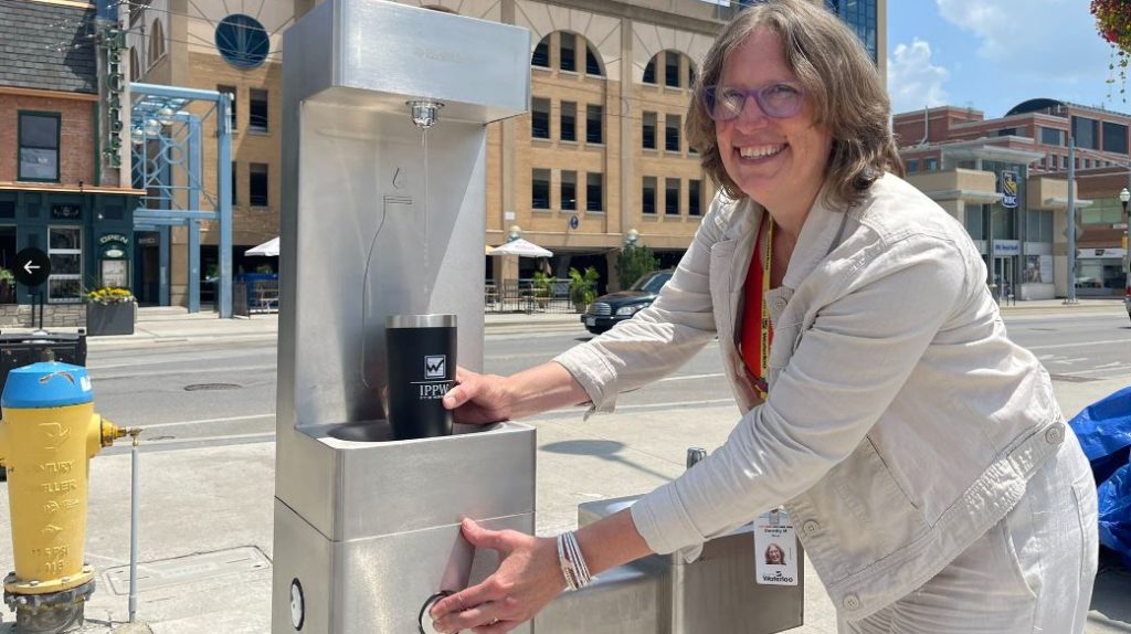 Waterloo Mayor Dorothy McCabe testing the new public drinking fountain in Waterloo Uptown Square (Josh Goeree/CityNews Kitchener)