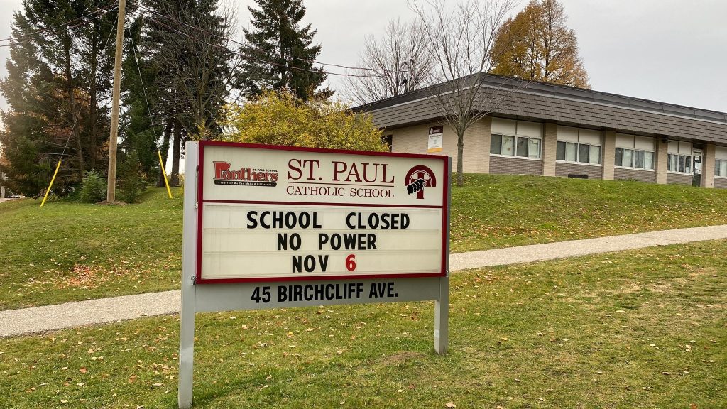 A message board outside St. Paul Catholic School reads "School Closed No Power Nov 6"