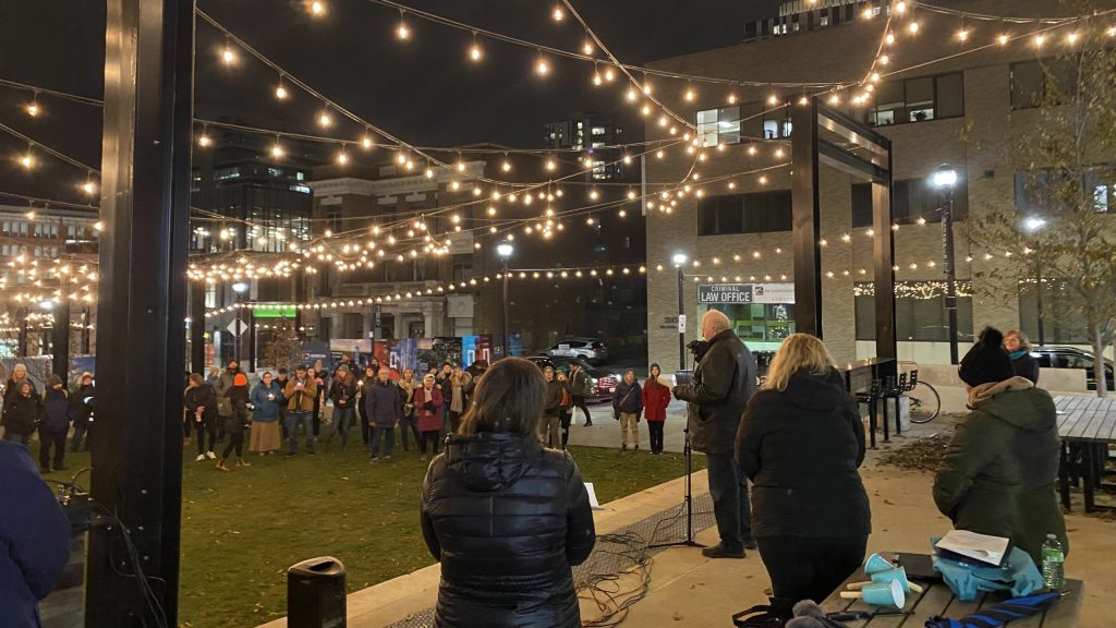 Local residents gather for a candlelight vigil in Kitchener for those living with homelessness - and those who have died.