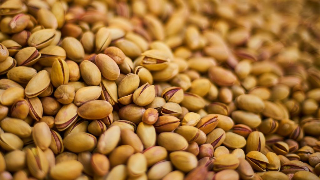 brown and beige nuts on brown wooden surface