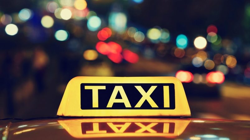 sign that reads taxi