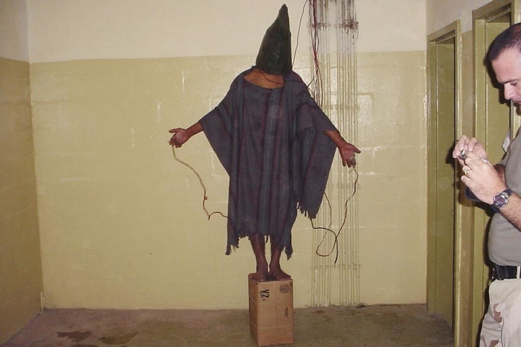 Civilian interrogator defends work at Abu Ghraib, tells jury he was promoted