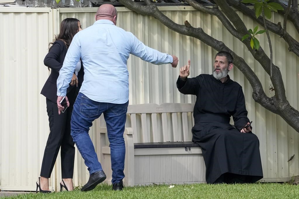 Tensions rise in Australia after a bishop and priest are wounded in a knife attack in a church