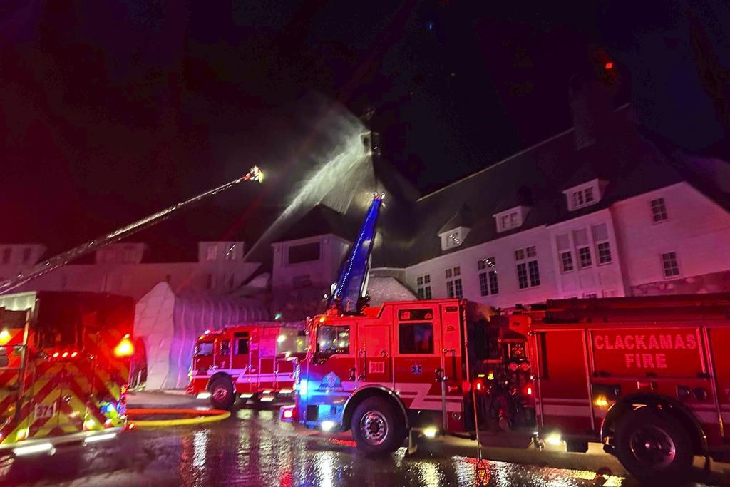 Firefighters douse a blaze at a historic Oregon hotel famously featured in 'The Shining'