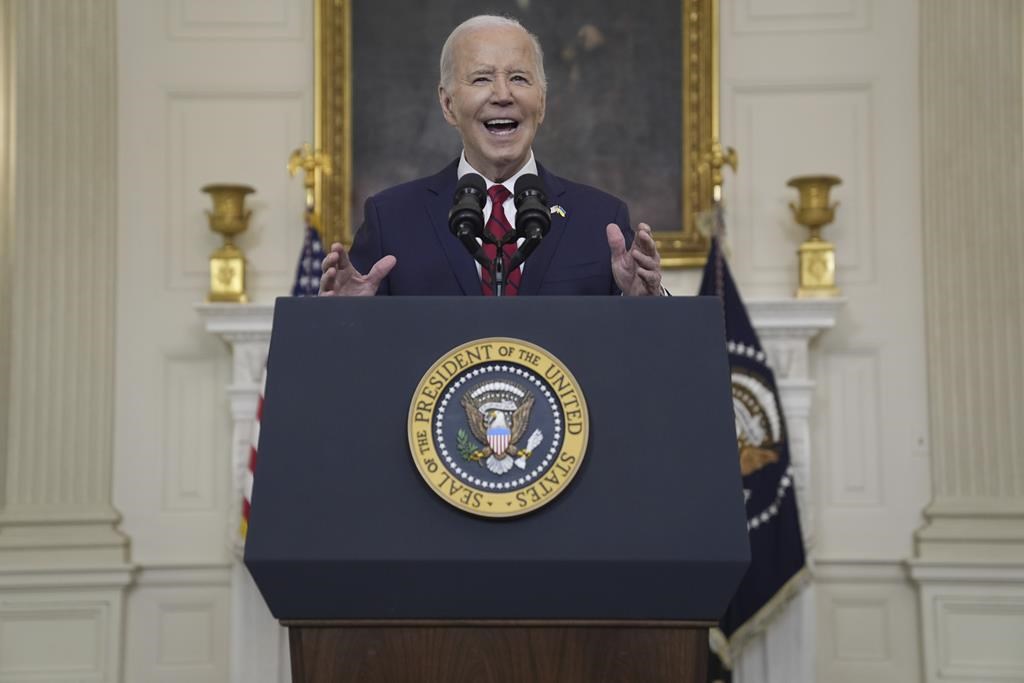 Biden says the US is rushing weaponry to Ukraine as he signs a 95