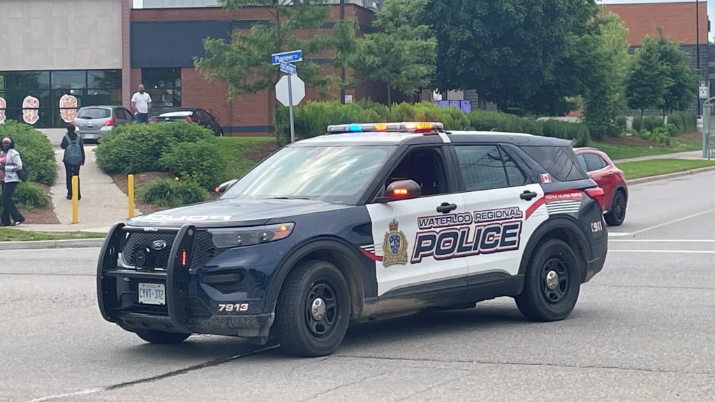 A police cruiser sits in the intersection of Pioneer Drive and Old Carriage Drive for an ongoing investigation.