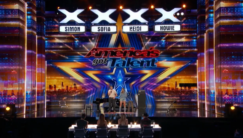 Two people on the stage of America's Got Talent
