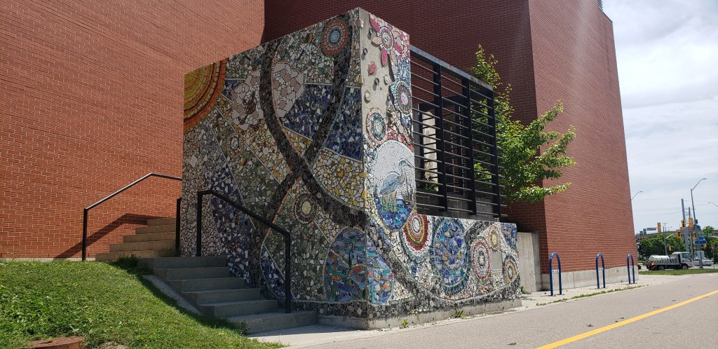 A concrete wall with a mosaic