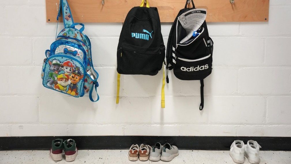 School bags hang on pegs at an elementary school in Toronto, Tuesday, Jan. 9, 2024. THE CANADIAN PRESS/Chris Young.