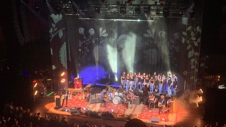 Local high school choir performs with rock acts on the big stage