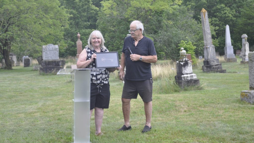 Cambridge Mayor Jan Liggett accepts transfer of Blair Cemetery ownership from Harry Chislette July 15. (Courtesy of the City of Cambridge.)