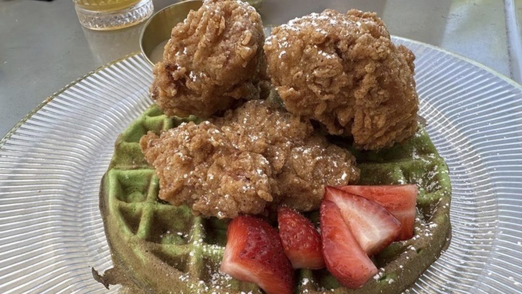 An order of "Resting Brunch Face," fried chicken on a pandan waffle with Vietnamese iced coffee syrup, is served at Breaking Dawn restaurant in Los Gatos, Calif., on