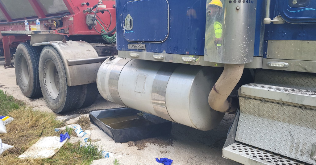 Punctured fuel tank on transport truck