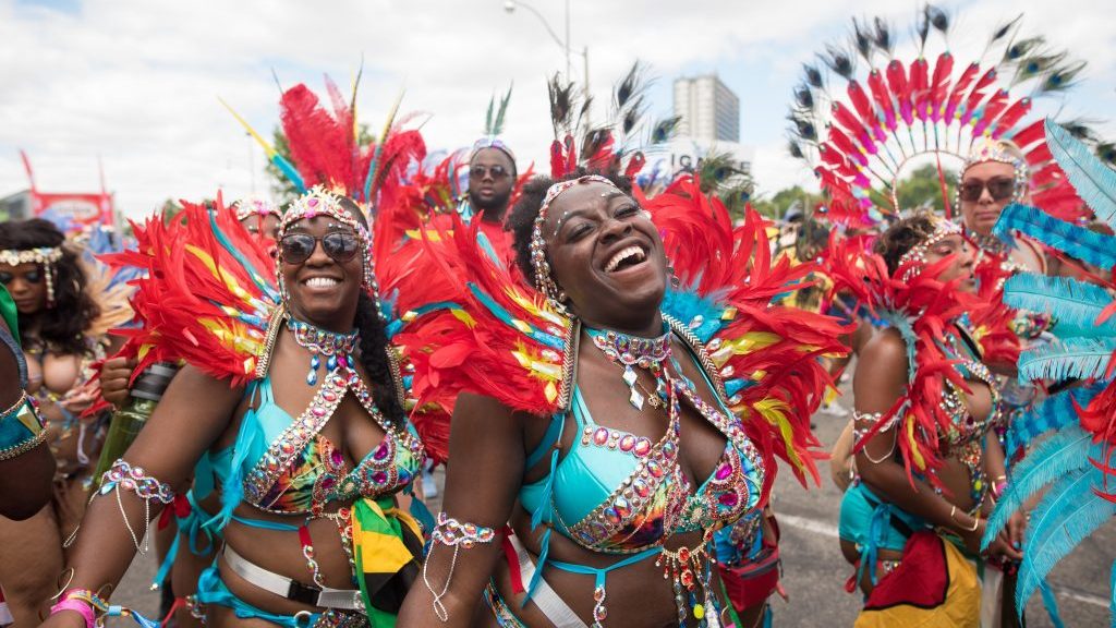 Participants perform during the Grand Parade at the Caribbean Carnival in Toronto on Saturday, July 30, 2022. The parade returned to the city after a two-year hiatus as a result of the COVID-19 pandemic. THE CANADIAN PRESS/ Tijana Martin