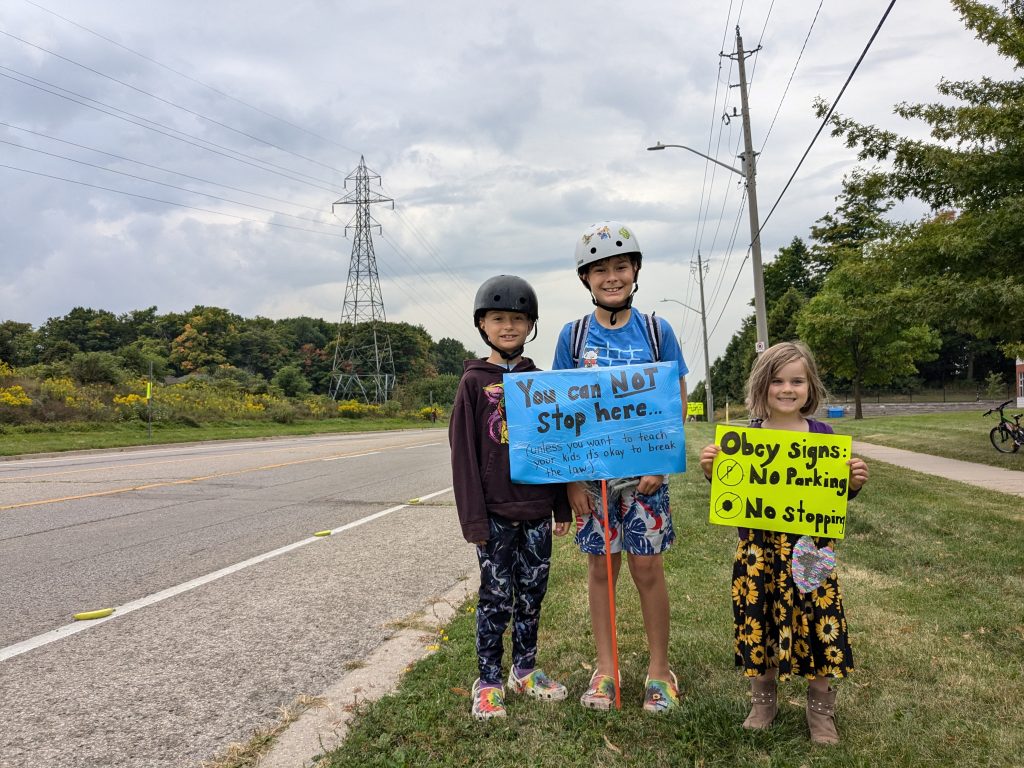 Kitchener family lines Victoria Street with bananas to educate drivers on bike safety