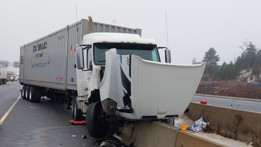 Transport truck hits median on 401 near Homer Watson Blvd