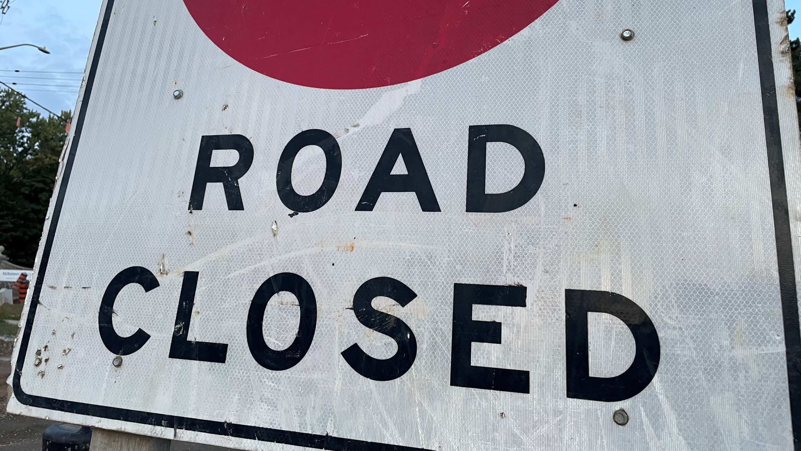 Road closed sign on a snowy highway