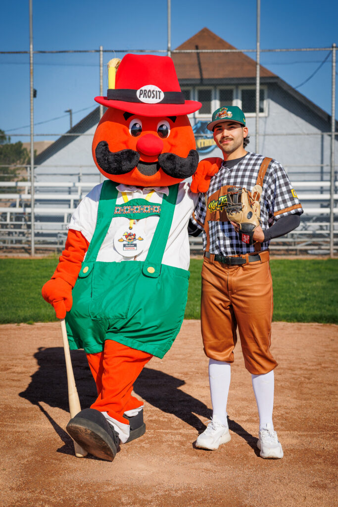 Kitchener Panthers player Petey Kiefer wearing a Berlin Keg Tappers uniform beside Onkel Hans