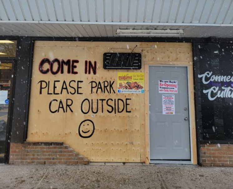Freshly baked bread hides behind a boarded up storefront at this